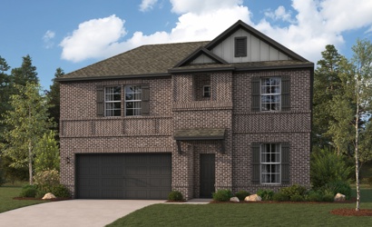 A brick house with a garage.
