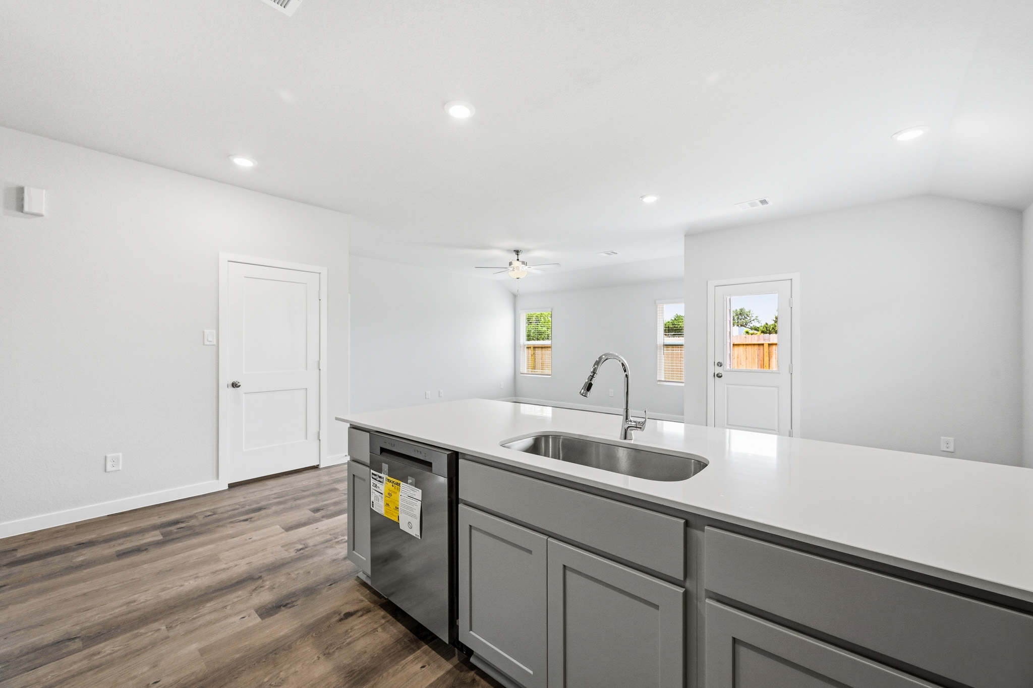 A kitchen with a sink and cabinets.