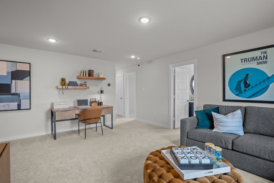 A living room with a couch and a table.