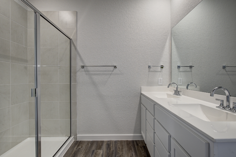 A bathroom with a glass shower.