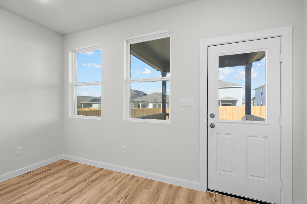 A room with windows and a door.