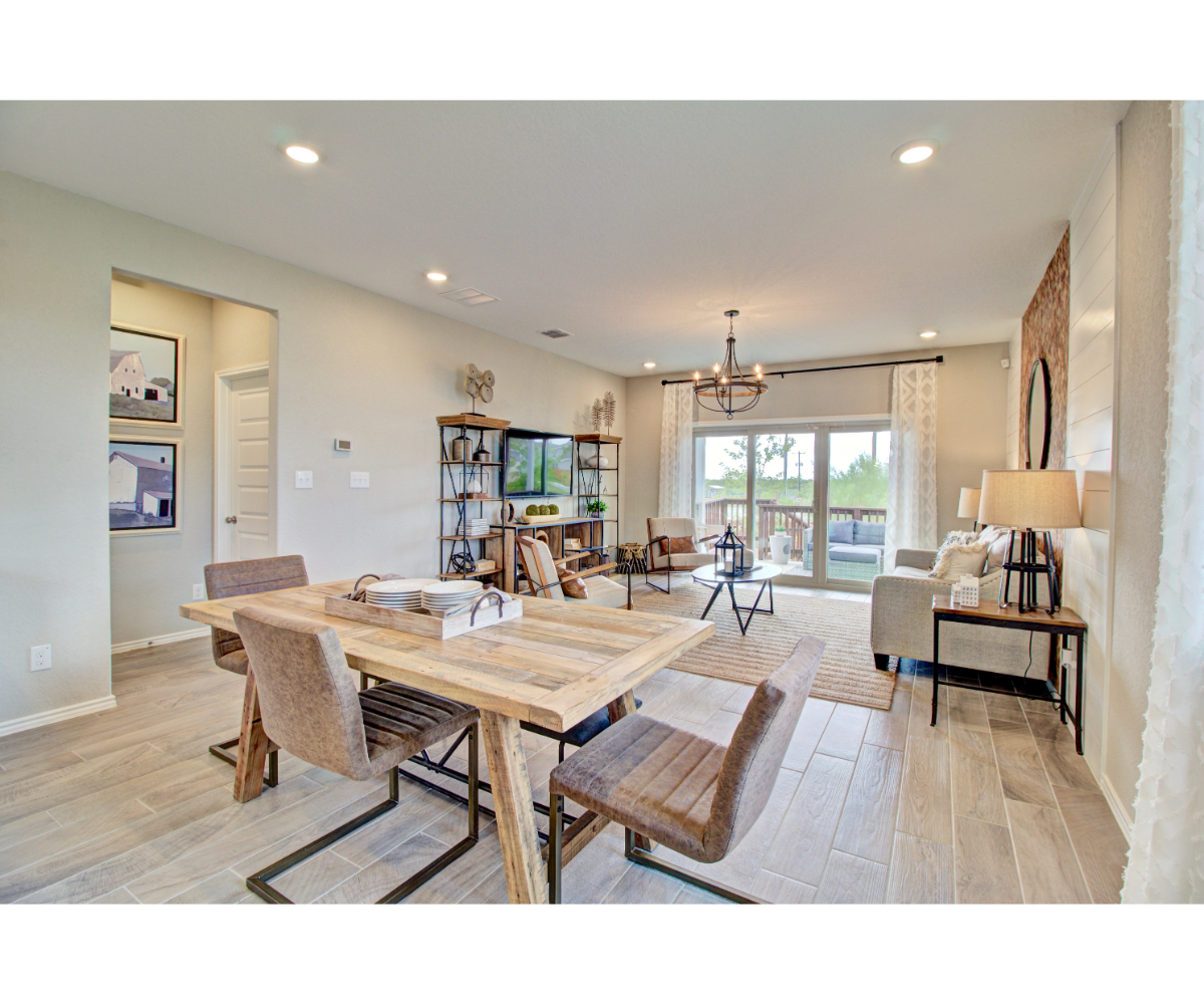 A dining room with a large table.