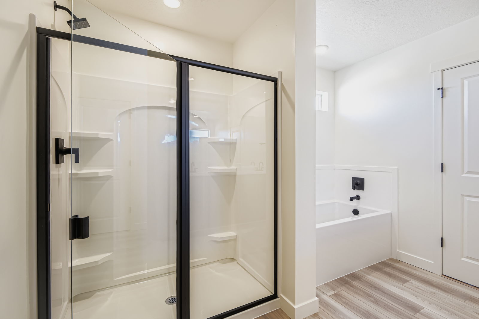 A bathroom with a glass shower.