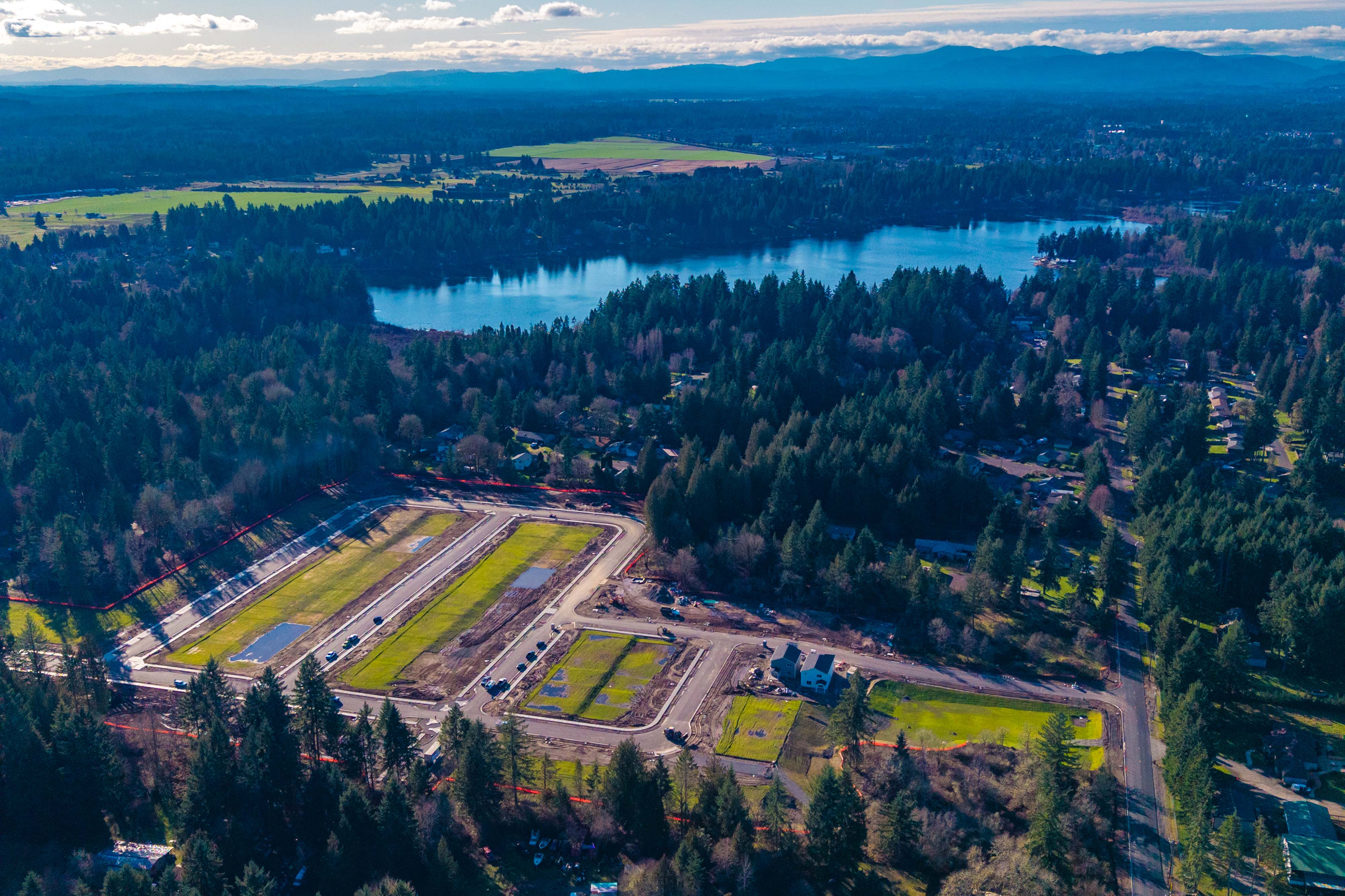 A landscape with a river and trees.
