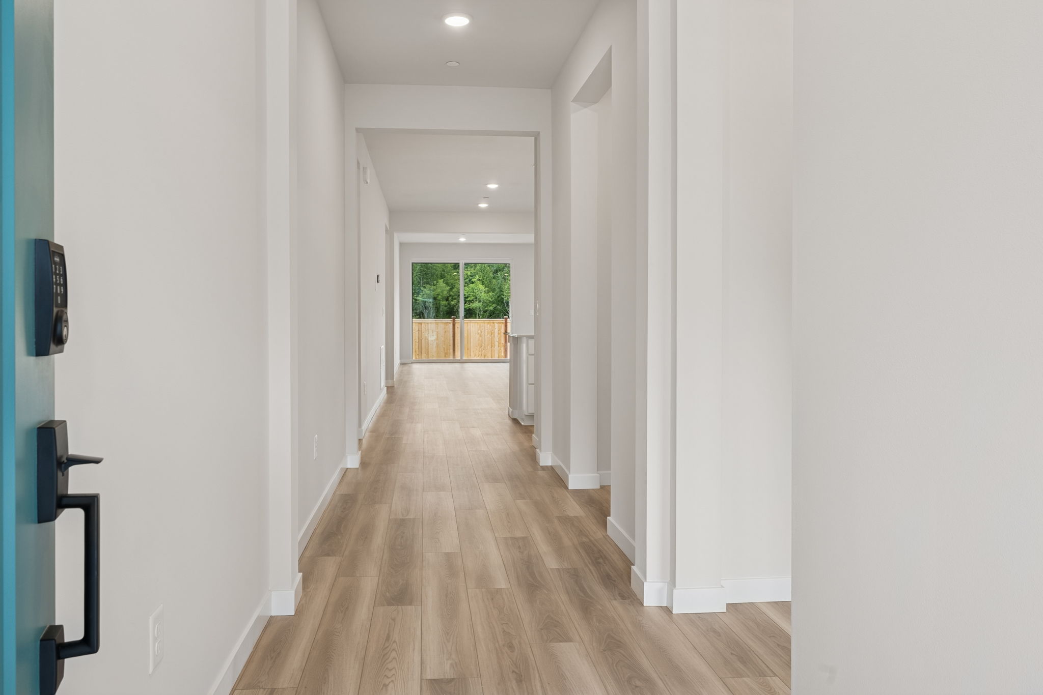 A long hallway with white walls.