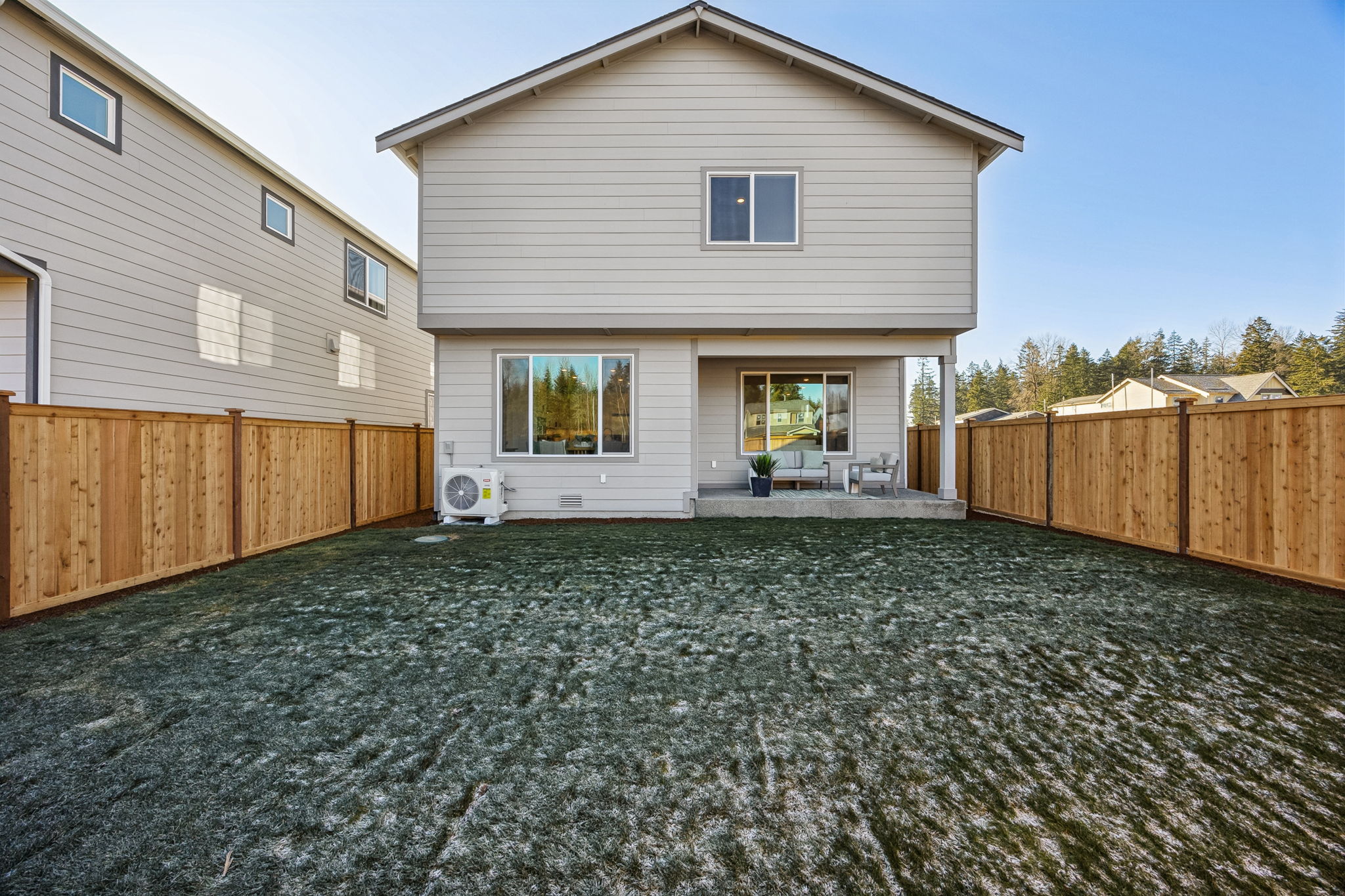 A house with a fence and grass.