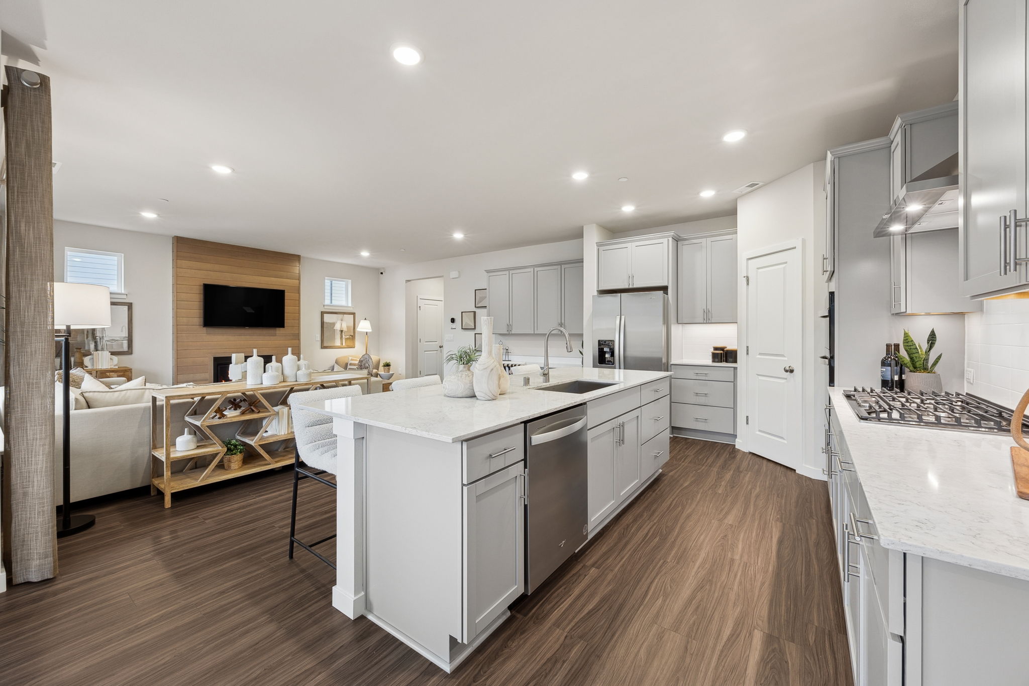 A kitchen with white cabinets.
