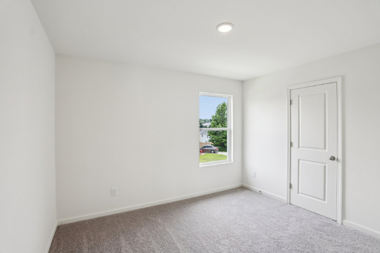 A room with a window and a door.