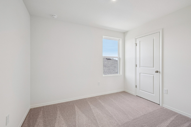 A room with a door and a window.