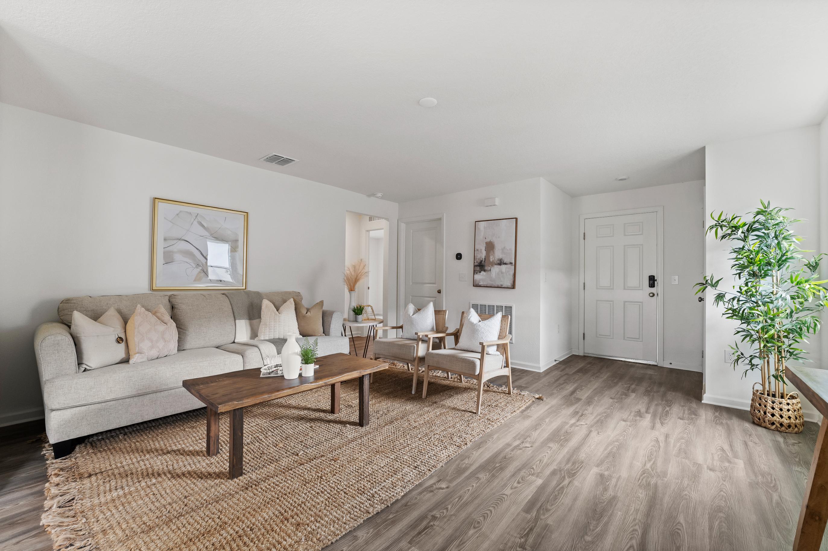 A living room with a couch and a coffee table.