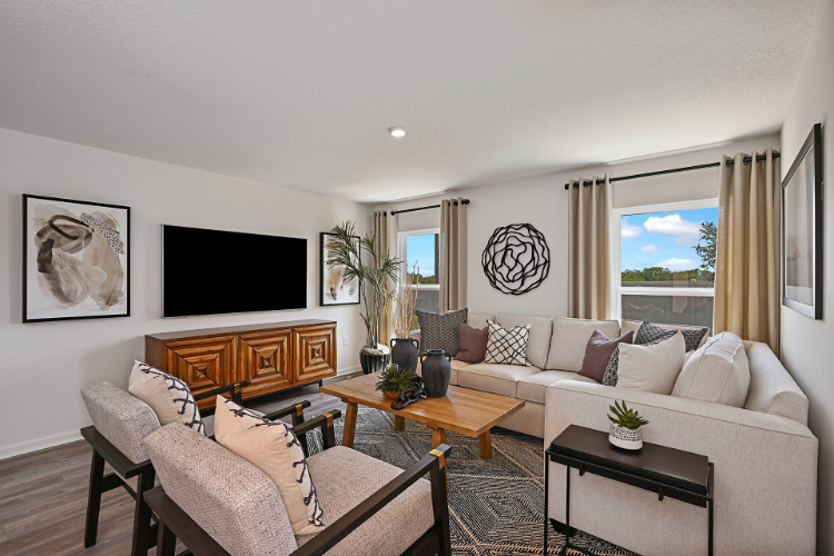 A living room with a couch and a tv.
