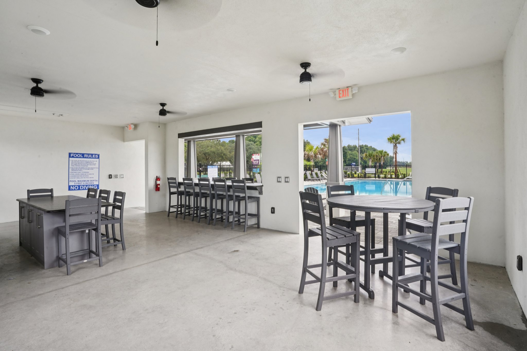 A room with tables and chairs.