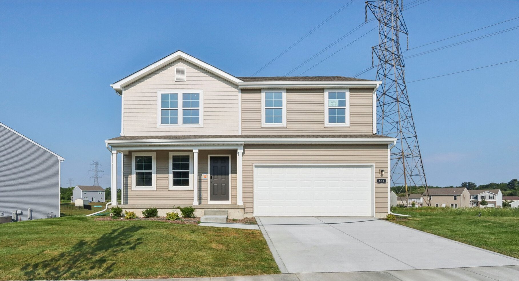 A white house with a garage.